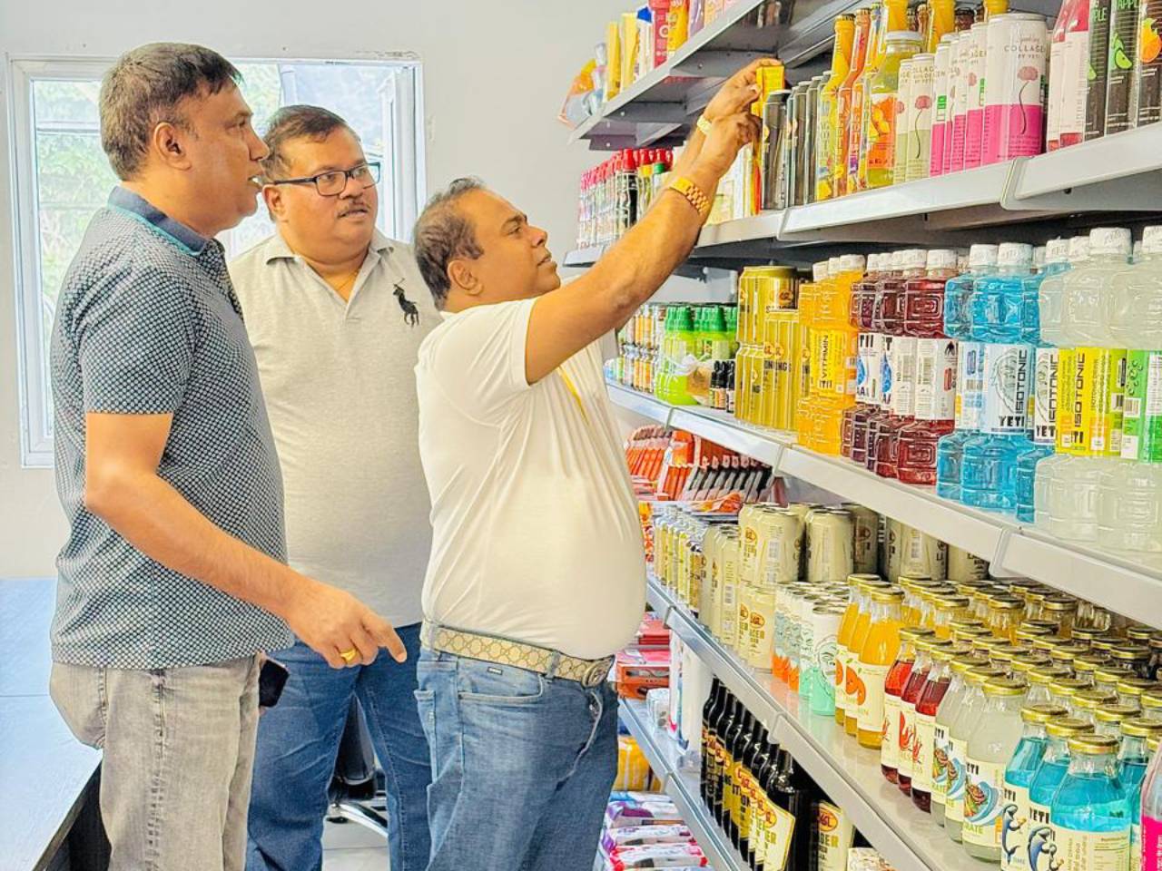 Business meeting in supermarket aisle